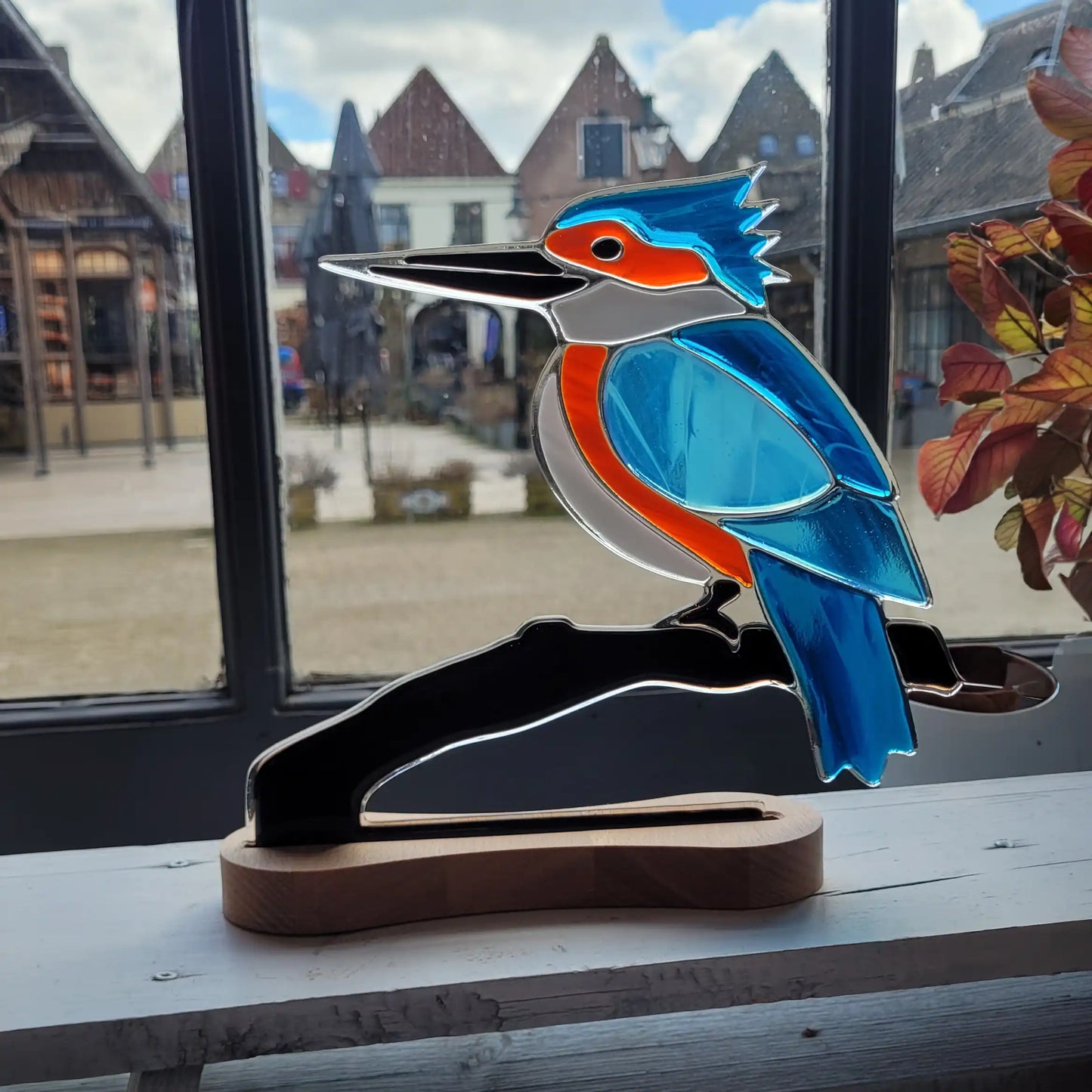 IJsvogel op houten voet
