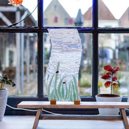 2 lieveheersbeestjes in het hoge gras